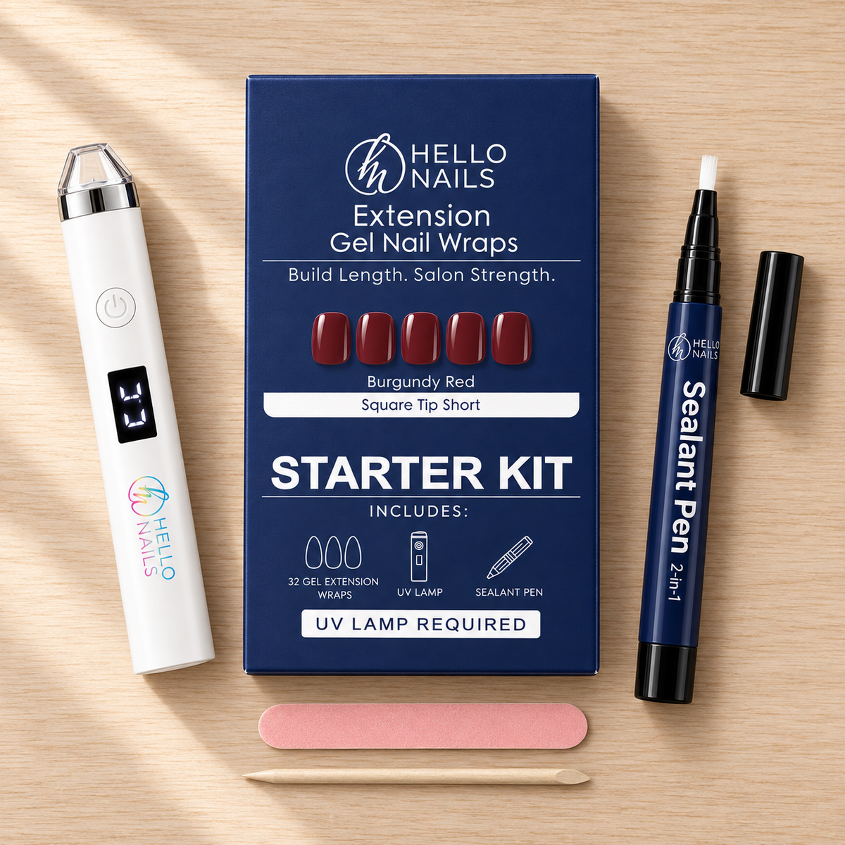 Extension Gel Starter Kit - Burgundy Red flat lay - box, UV lamp, sealant pen, nail file and cuticle stick