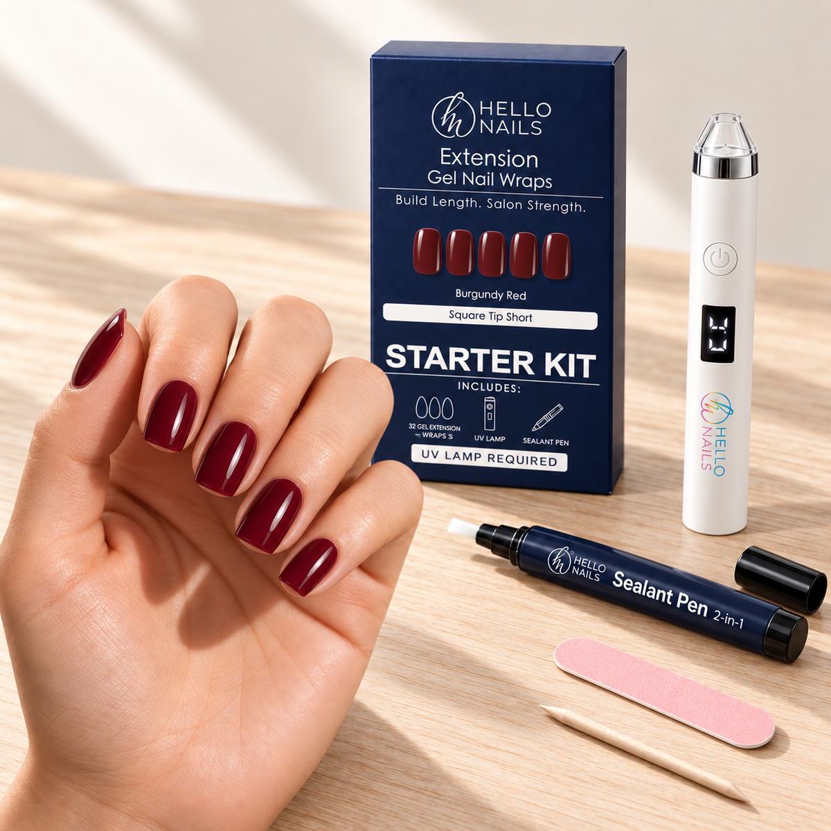 Extension Gel Starter Kit - Burgundy Red hero - hand with square tip short burgundy nails, kit box and contents